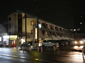 A hotel with a modern design, featuring a prominent staircase and a visible entrance. - Palace Inn Toyota (Toyota)