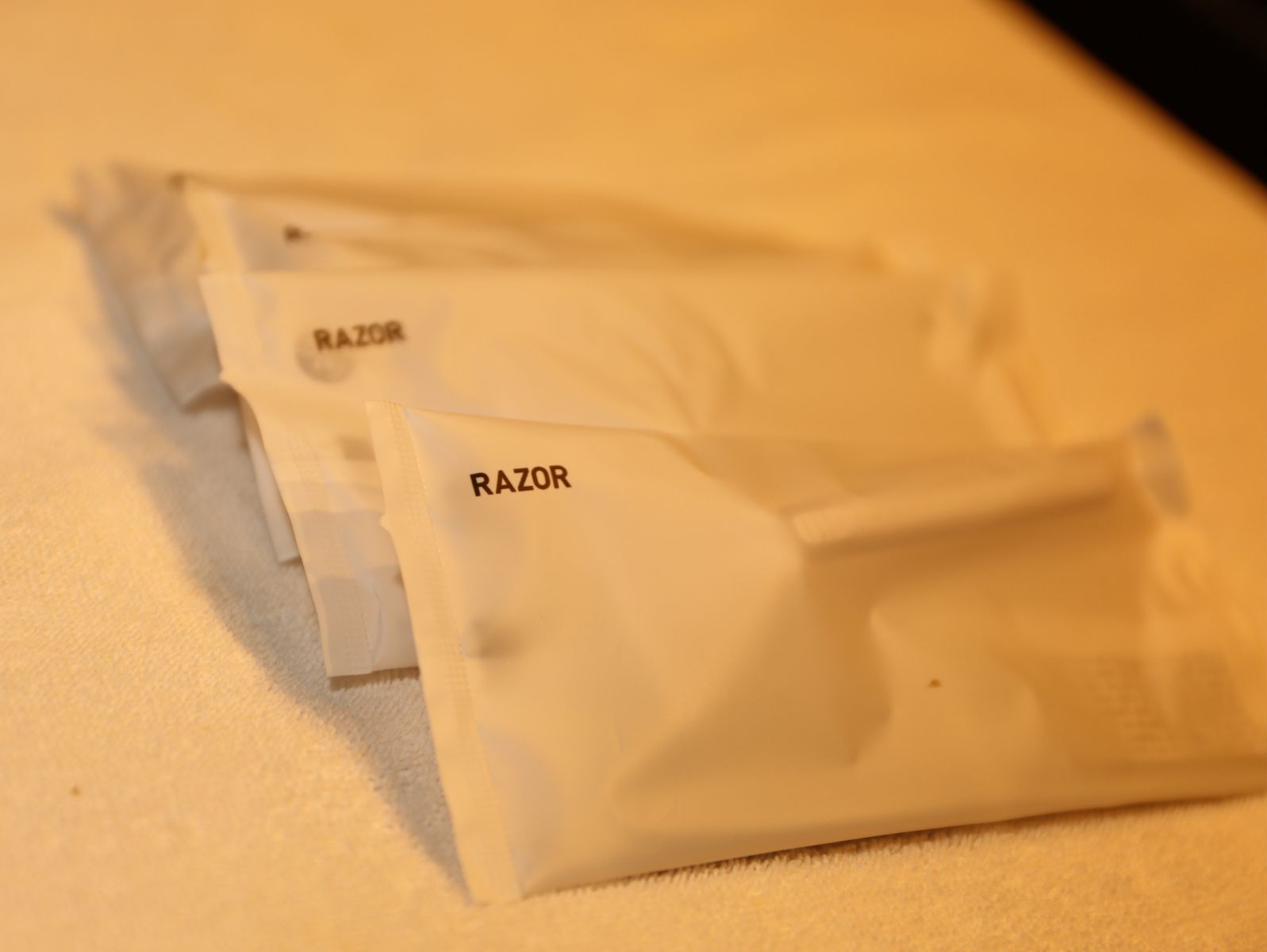 A close-up of a white package with the word 'RAZOR' on it.