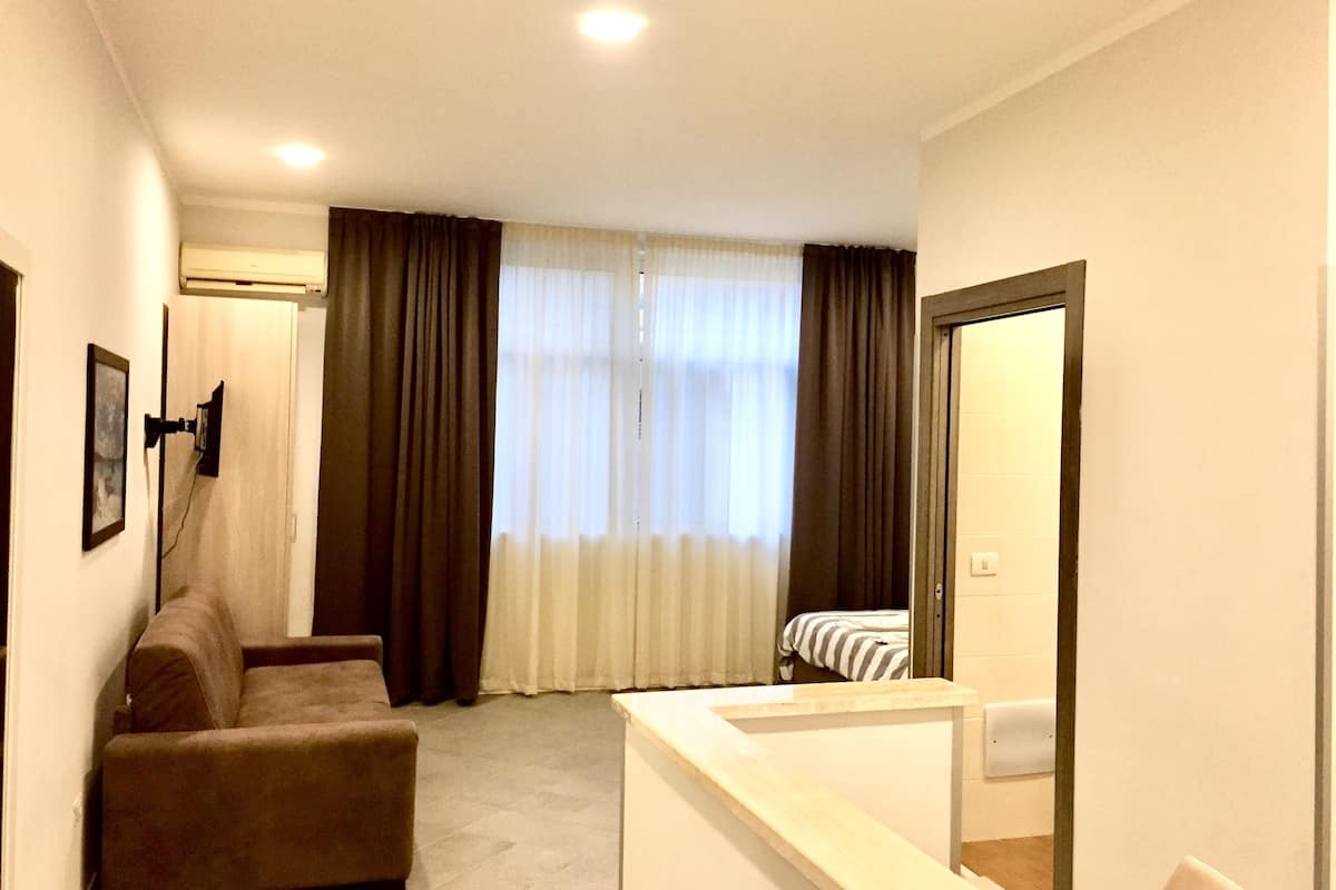 junior suite | living room | 32-inch flat-screen tv with satellite channels, tv