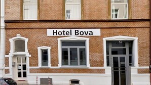 A multi-story brick building with the sign "Hotel Bova" at the ground level. - Bova Hotel Frankfurt (Frankfurt)
