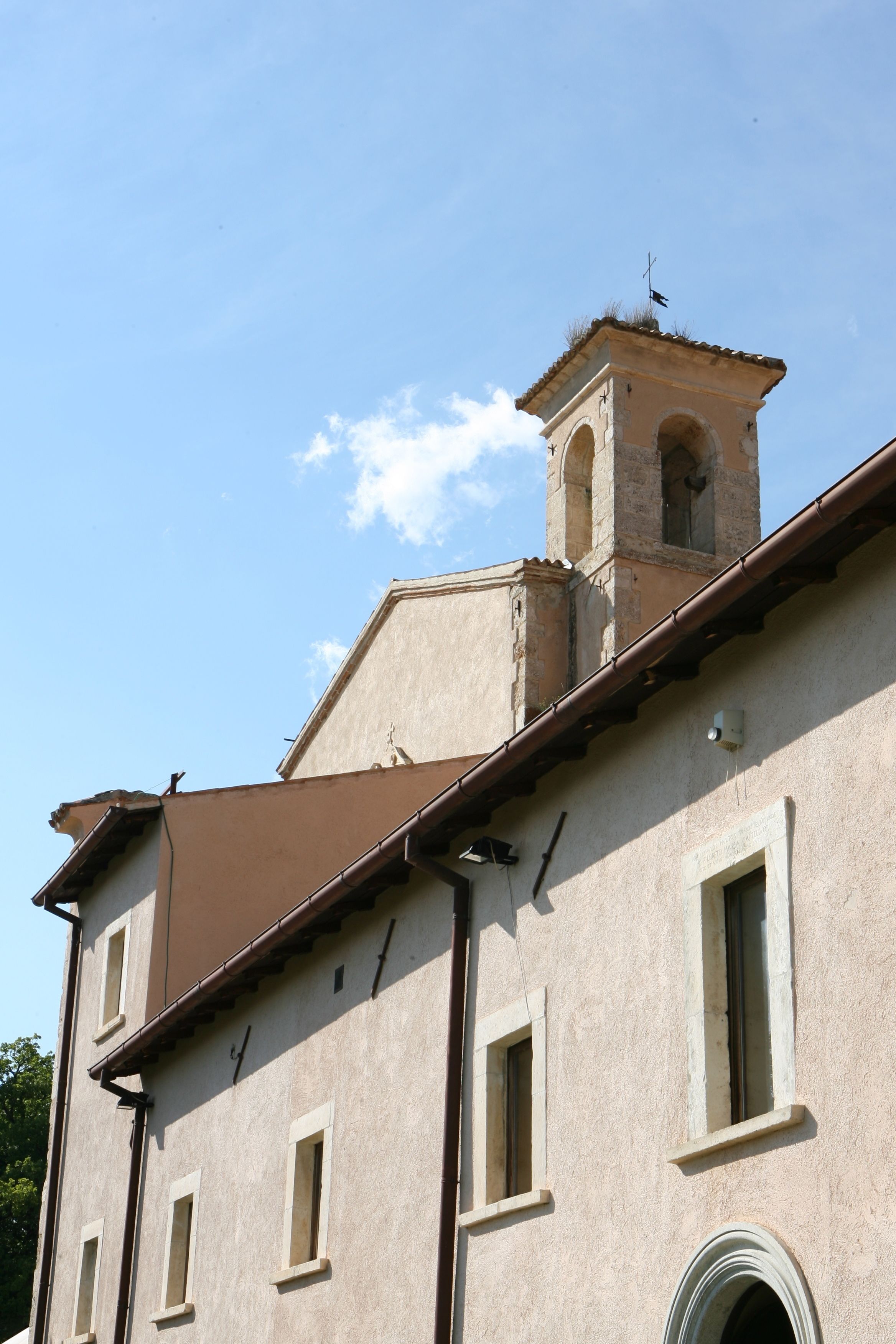 A building with a prominent tower and multiple windows.