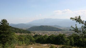 A mountainous landscape with a town in the valley.