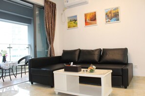 Apartamento executivo, 1 quarto | Sala de estar | TV LCD