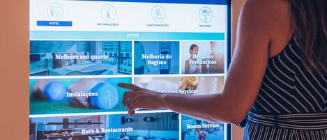 A digital display of a hotel website with sections for hotel information, room details, and amenities.