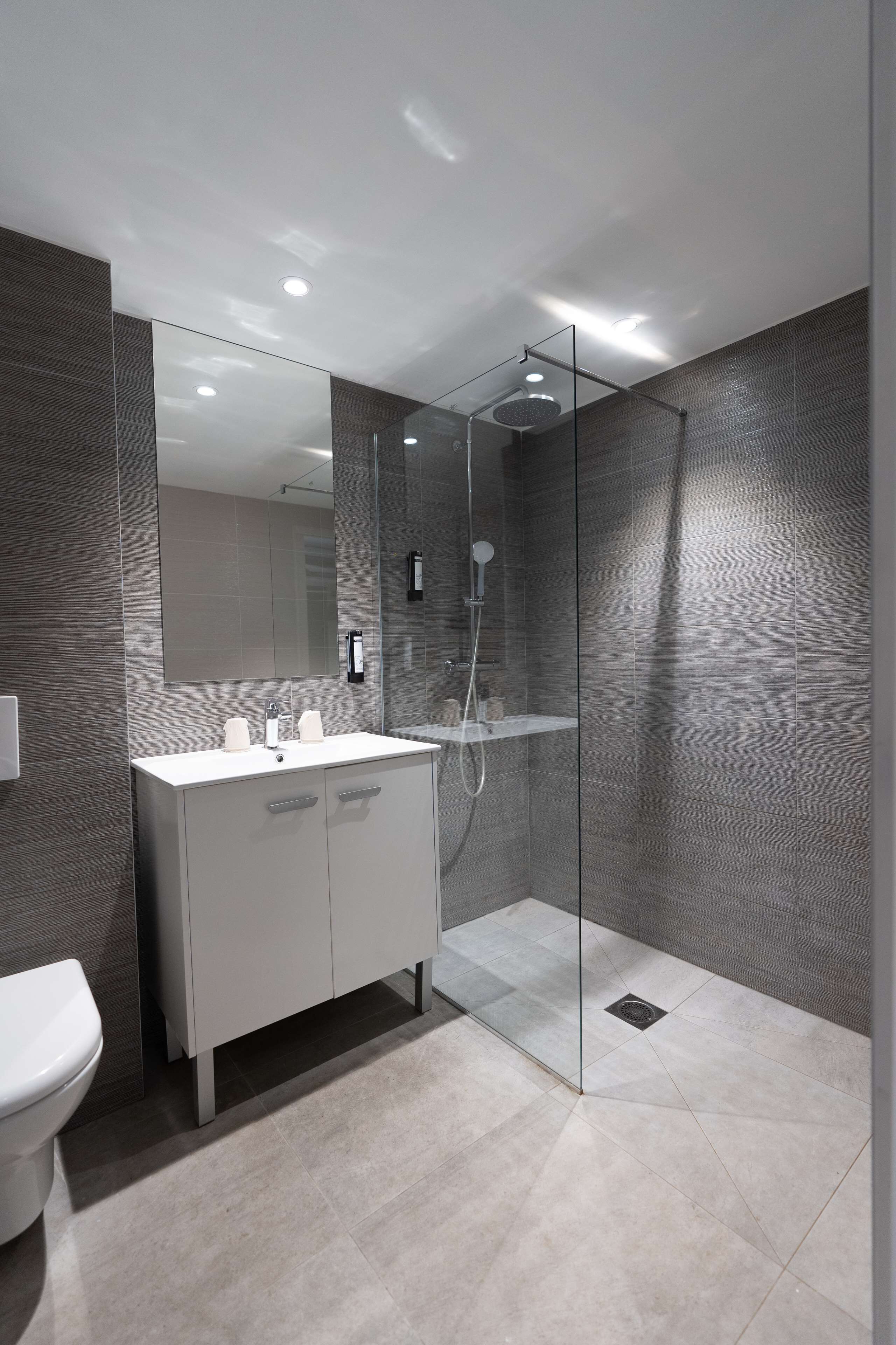 shower, rainfall showerhead, eco-friendly toiletries, towels