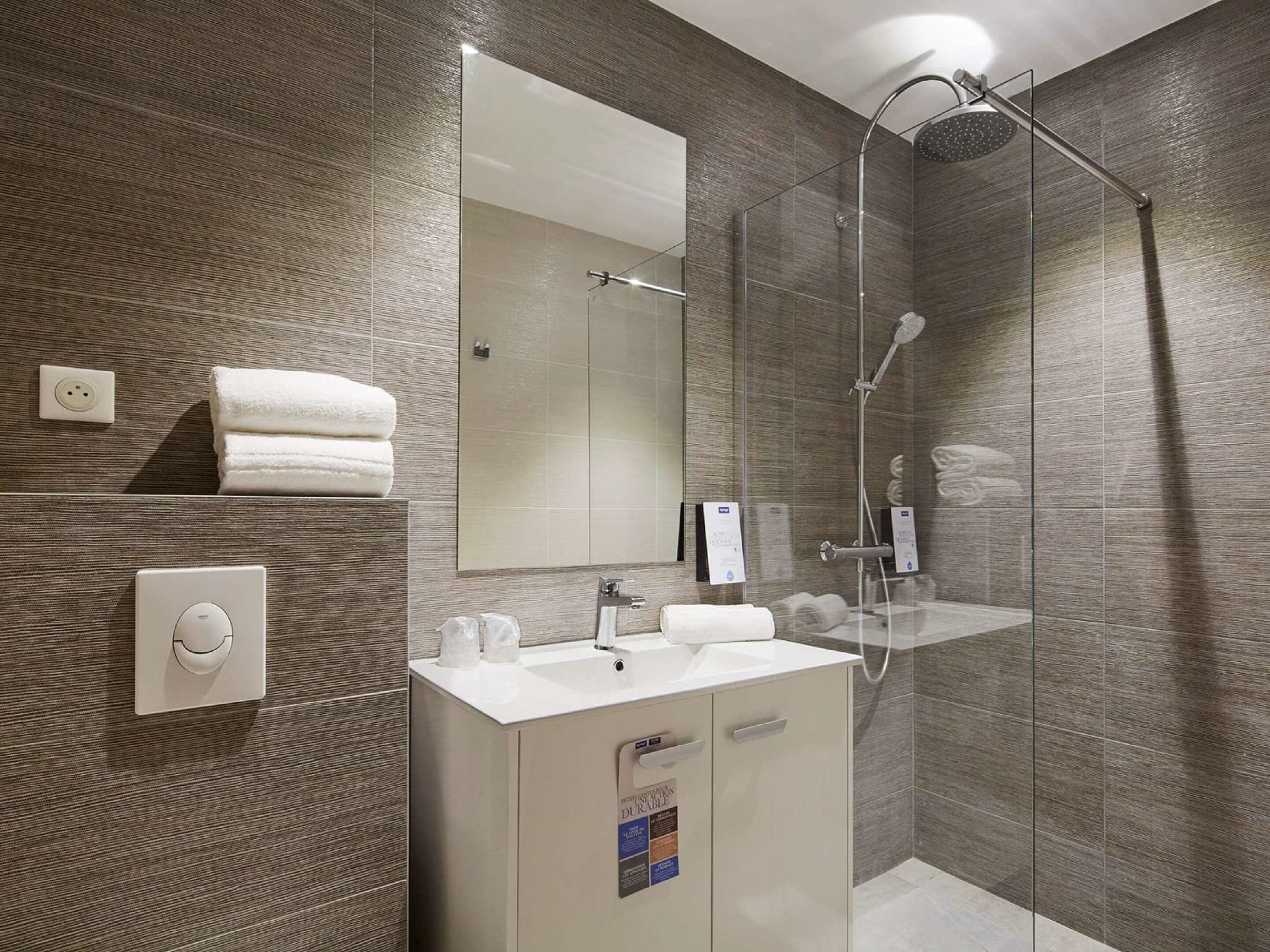 shower, rainfall showerhead, eco-friendly toiletries, towels