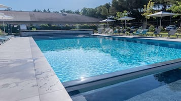 Outdoor pool, open 9:00 AM to 8:00 PM, pool umbrellas, pool loungers