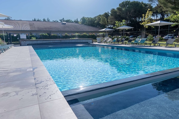 Outdoor pool, open 9:00 AM to 8:00 PM, pool umbrellas, sun loungers