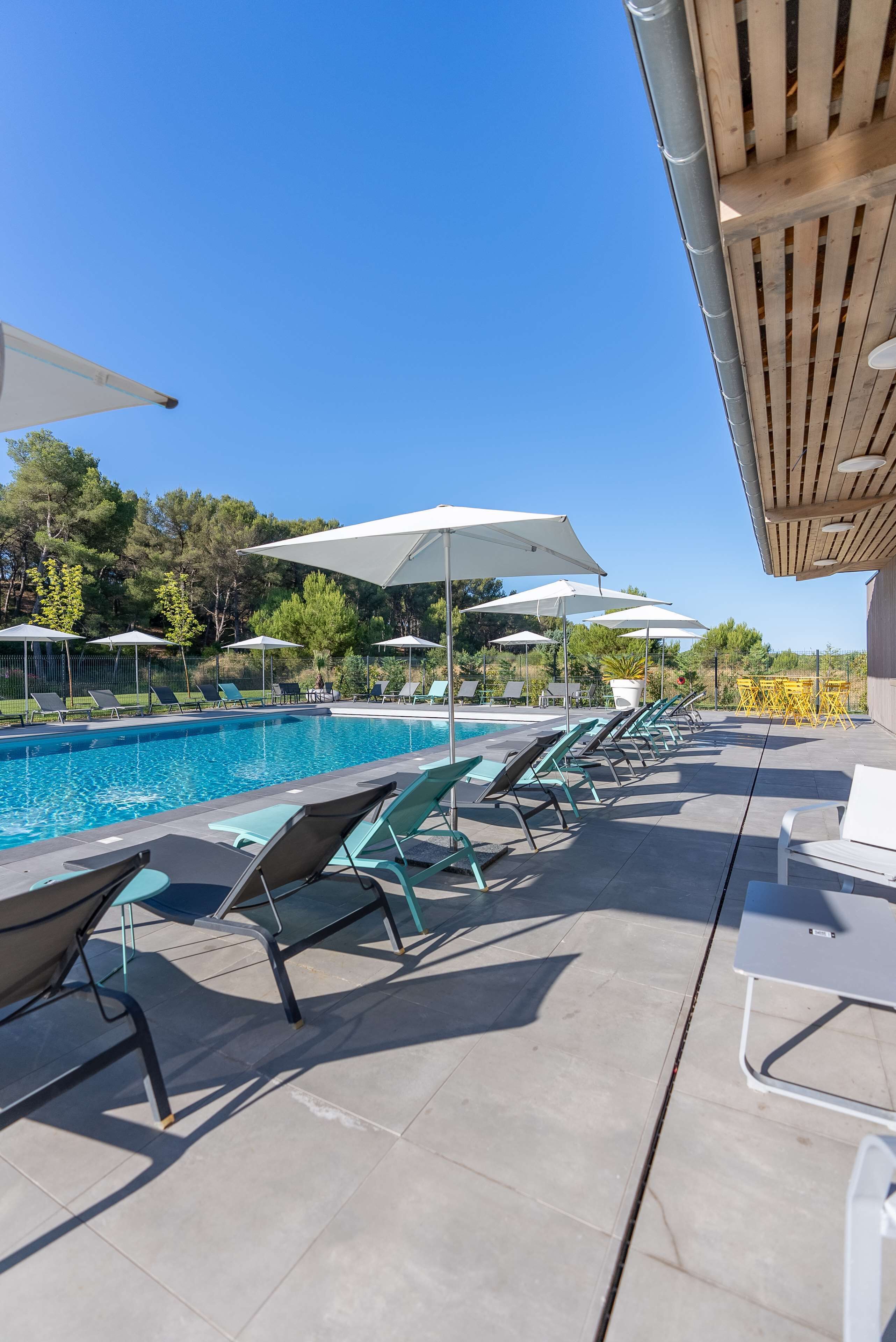 Outdoor pool, open 9:00 AM to 8:00 PM, pool umbrellas, pool loungers