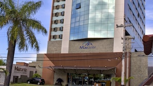 A modern hotel with a glass facade, a covered entrance, and a sign for 'Marante Executive Hotel'. - Marante Executive Hotel (Recife)