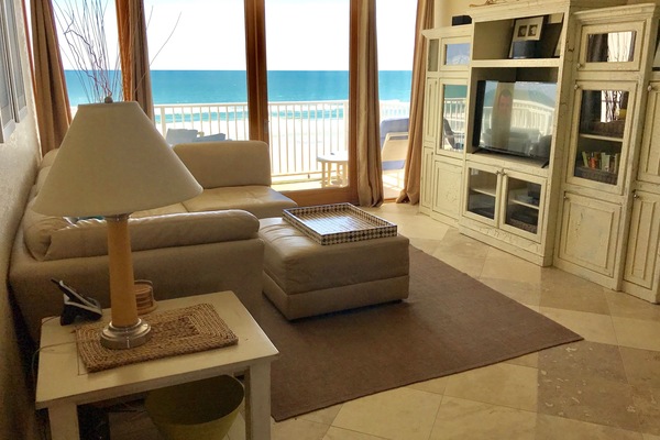 Living room with oceanfront balcony. Smart LED TV, DVD player