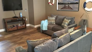 Flat-screen TV, video games, DVD player, foosball