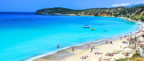 On the beach, sun-loungers