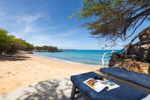 On the beach, sun loungers, beach towels