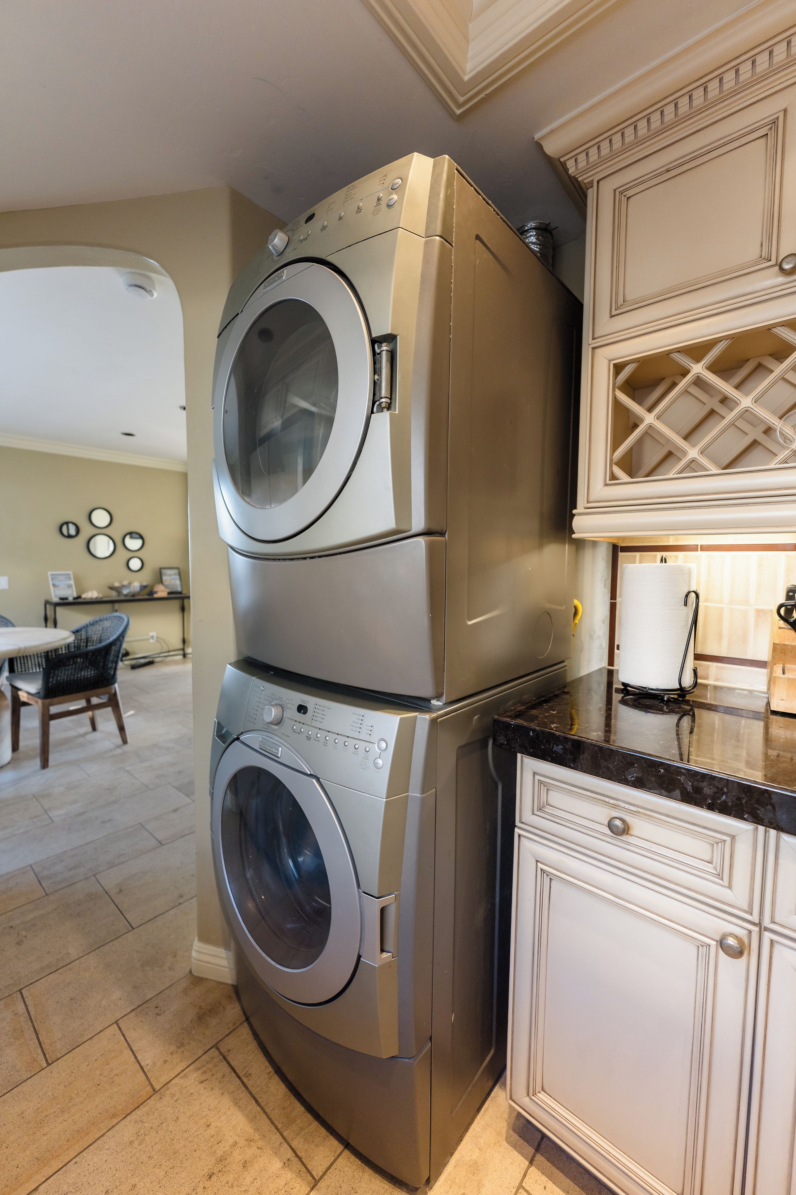 A compact kitchen with a double-door oven and a built-in washing machine.