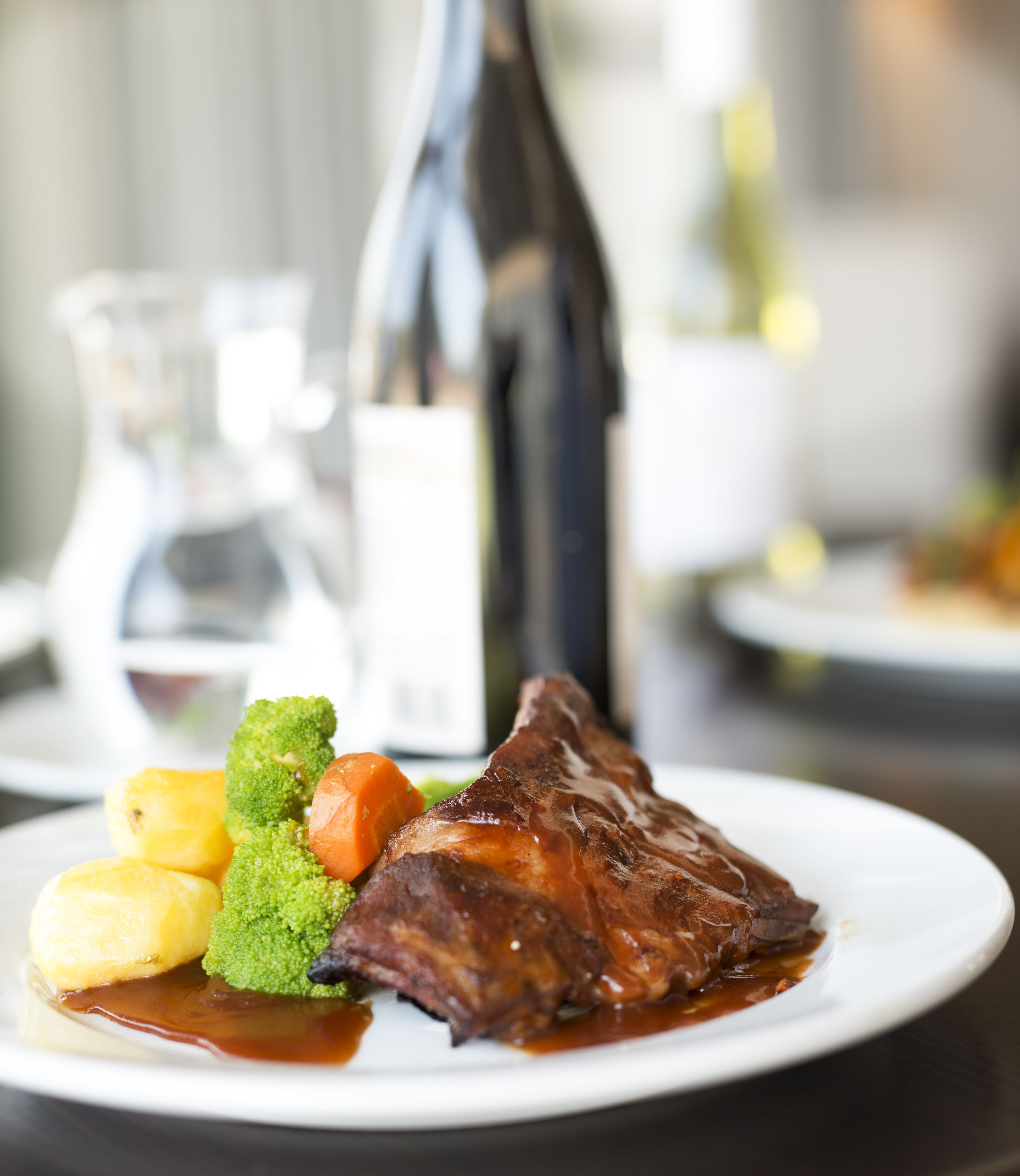 A plate with a steak, broccoli, and potatoes.
