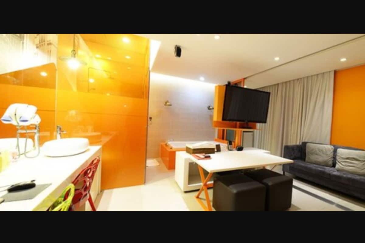 suite (mixed gender of adults not allowed) | living area | flat-screen tv, netflix, heated floors, streaming services