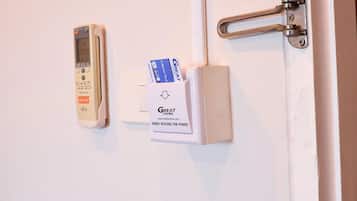 A door with a keycard reader and a lock mechanism.