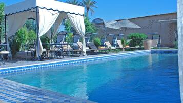 Outdoor pool, pool umbrellas, sun loungers