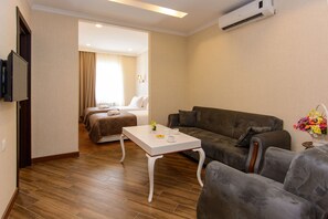 Apartment, 2 Bedrooms | Living area | 32-inch flat-screen TV with satellite channels, TV