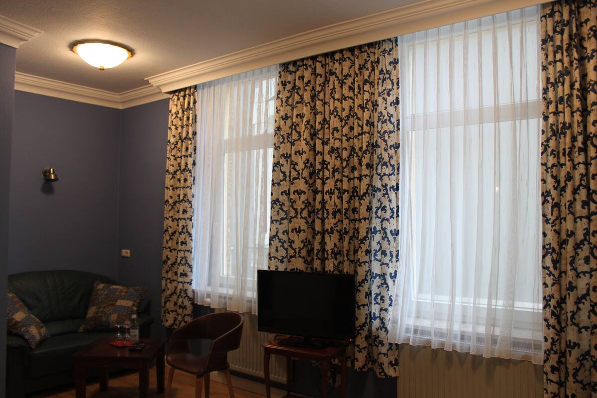 comfort double room | living area | flat-screen tv