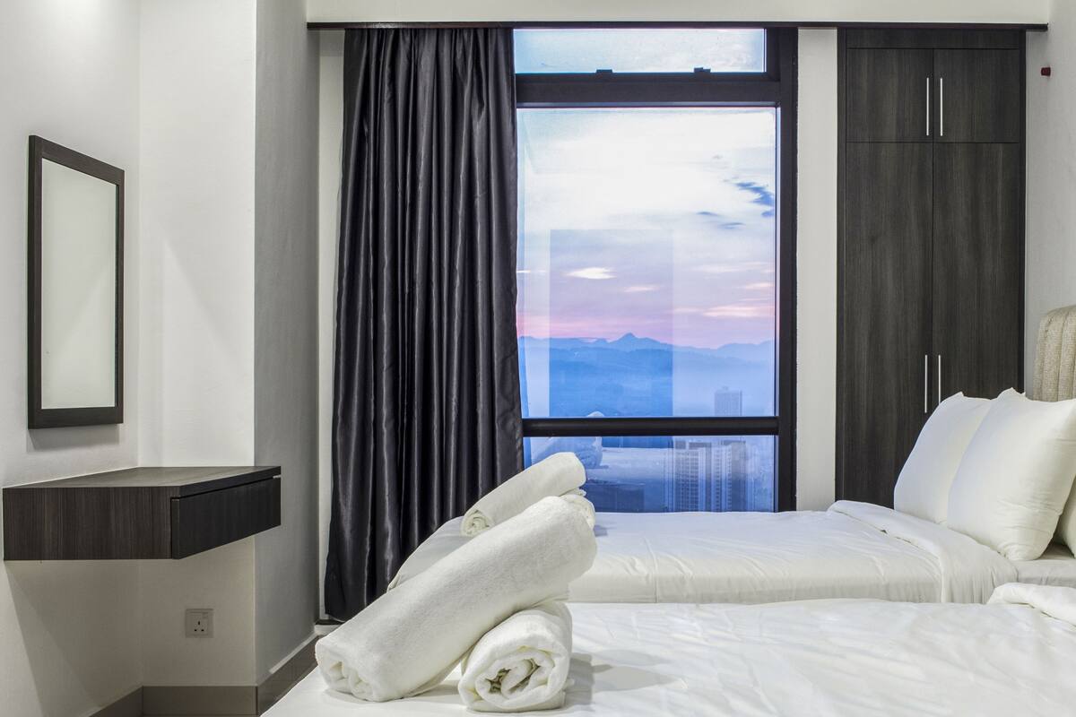 Premium bedding, pillow-top beds, minibar, laptop workspace