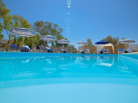 Outdoor pool, open 11:00 AM to 7:00 PM, pool umbrellas, sun loungers
