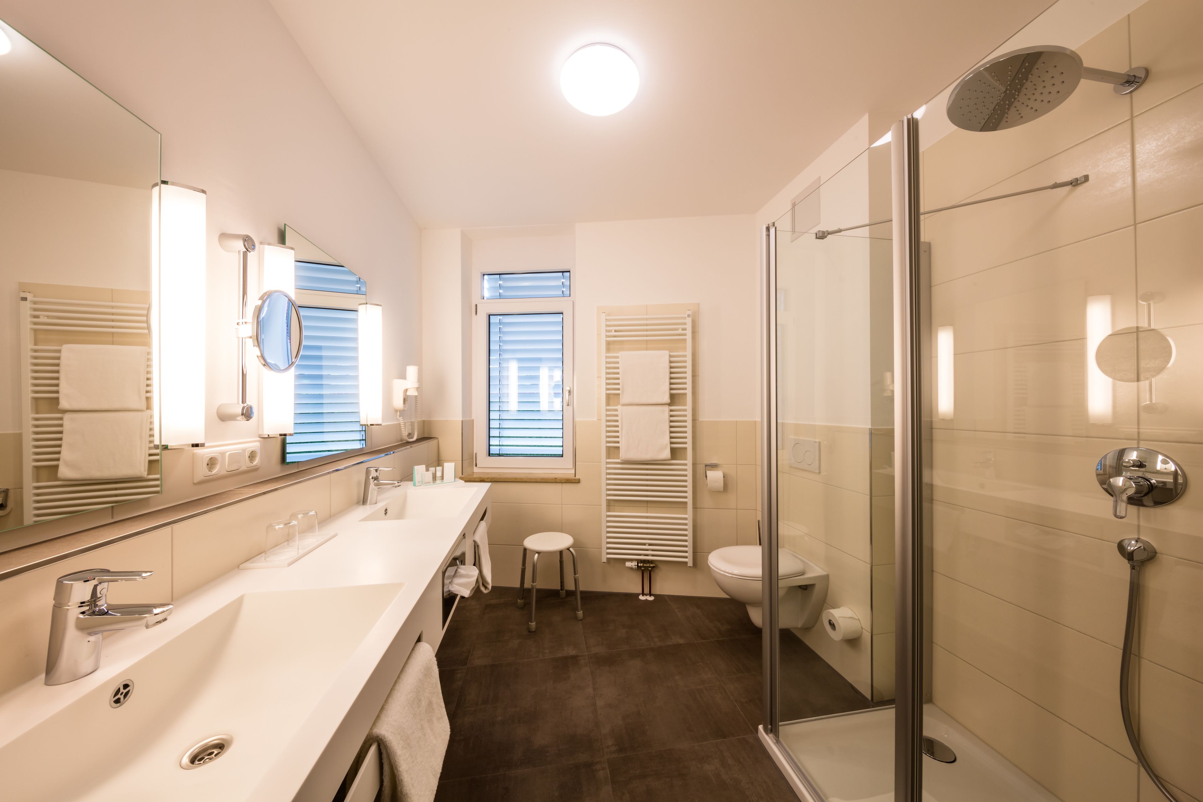 deluxe double room, refrigerator & microwave | bathroom | free toiletries, hair dryer, slippers, towels