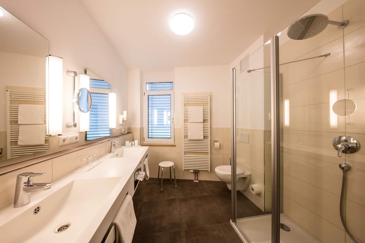 deluxe double room, refrigerator & microwave | bathroom | free toiletries, hair dryer, slippers, towels