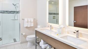 Designer toiletries, hair dryer, towels, soap