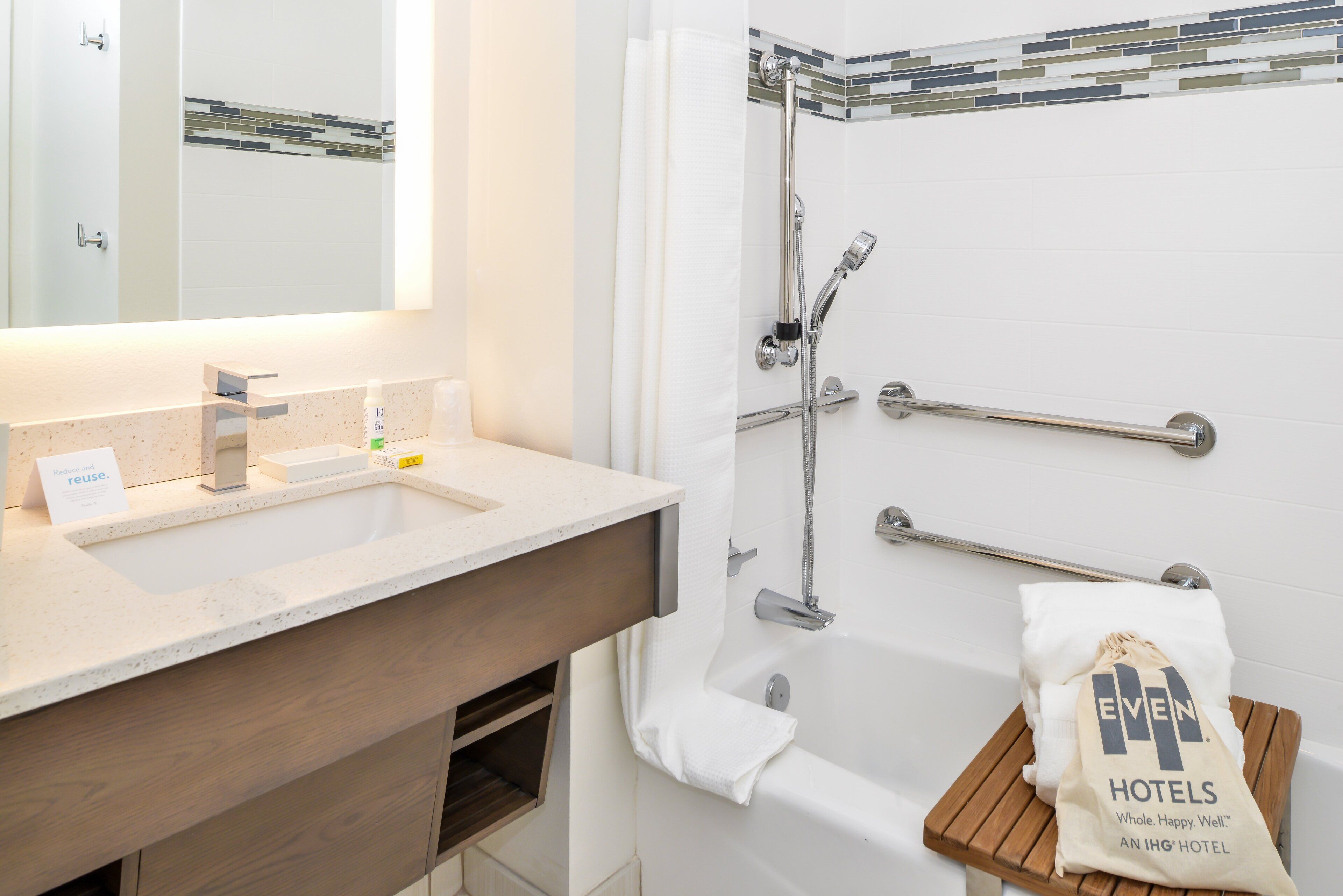 designer toiletries, hair dryer, towels, soap