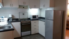 Apartment, 2 Bedrooms | Private kitchen | Full-size fridge, microwave, oven, stovetop