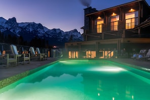 Outdoor pool, a heated pool, open 8:00 AM to 10:00 PM, pool loungers