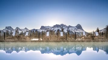 Outdoor pool, a heated pool, open 8:00 AM to 10:00 PM, pool loungers