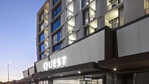 A modern hotel with a prominent 'QUEST' sign, multiple balconies, and a clean, contemporary facade. - Quest Innaloo (Innaloo)