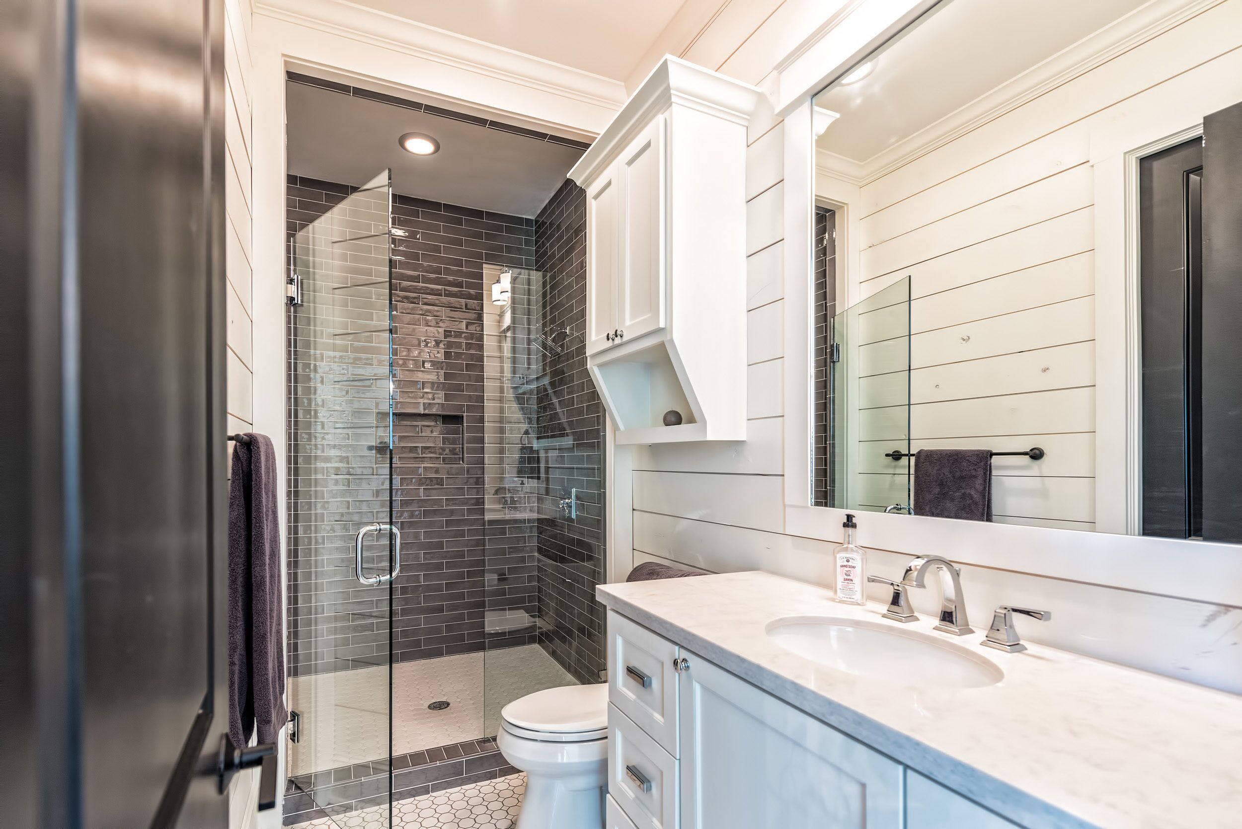 Combined shower/tub, hair dryer, towels, soap