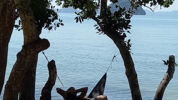 On the beach, sun-loungers, beach towels