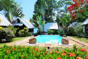 Outdoor pool, pool umbrellas, sun loungers