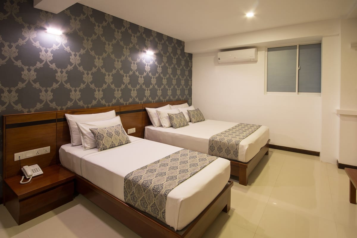 Deluxe Triple without Balcony | 1 bedroom, in-room safe, desk, iron/ironing board