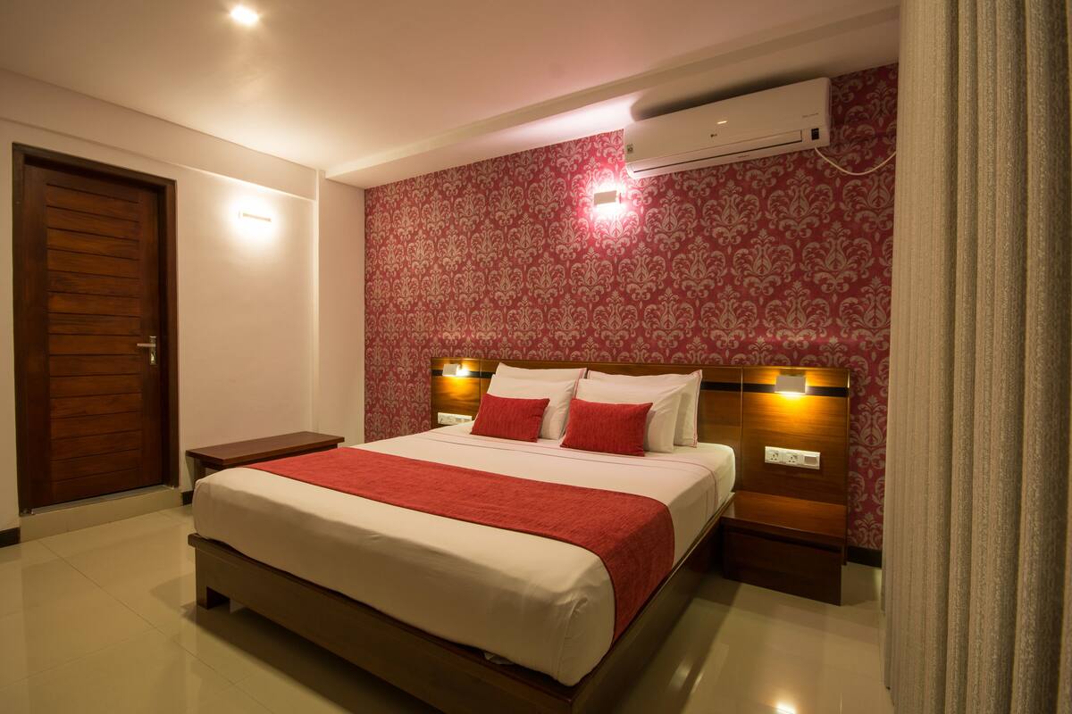 Deluxe Double with Balcony | 1 bedroom, in-room safe, desk, iron/ironing board
