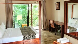 A bedroom with a bed, a desk, a chair, and a bench. - Chinyonga Guesthouse (Blantyre)