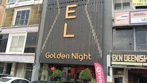 A hotel with a prominent 'Golden Night' sign, multiple windows, and a visible storefront with signage. - Golden Night Hotel Sunway (Subang Jaya)