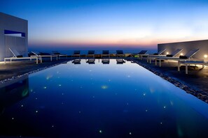Seasonal outdoor pool, pool umbrellas, pool loungers