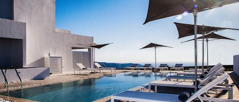 Seasonal outdoor pool, pool umbrellas, sun loungers