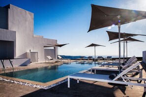 Seasonal outdoor pool, pool umbrellas, pool loungers