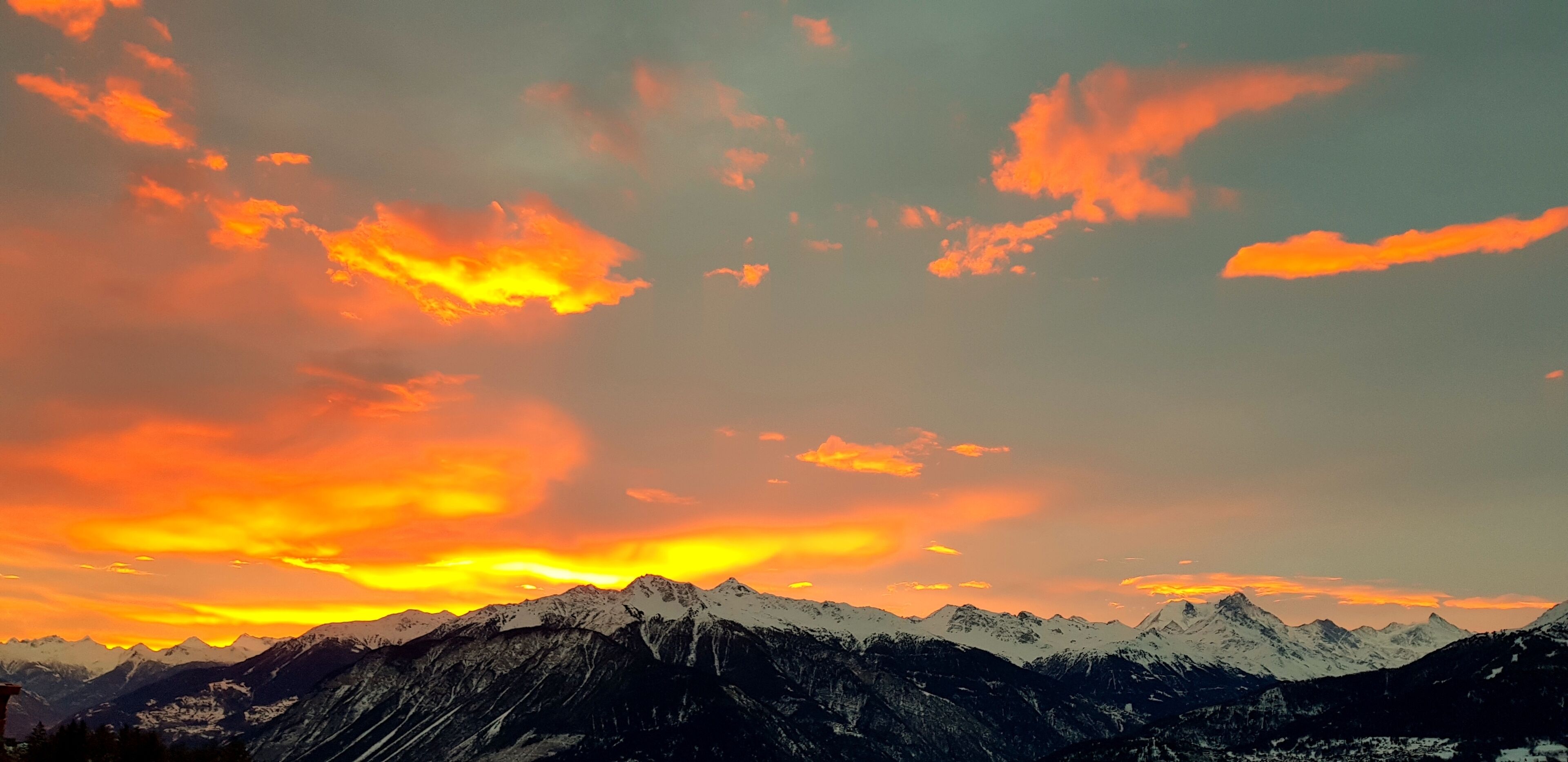A mountain range with a sunset sky.