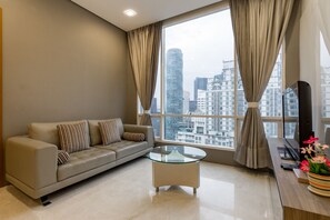 Family Apartment, 3 Bedrooms, 2 Bathrooms, City View (Soho 1) | Living room | 43-inch LCD TV with digital channels, TV - Soho Suites KLCC By Aloha (Kuala Lumpur)
