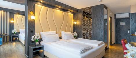 Comfort Quadruple Room | Minibar, in-room safe, desk, blackout drapes