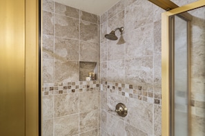 A shower with a handheld showerhead and a wall-mounted control. - Shores At Waikoloa #234 At Bo Tree Tower 2 Bedroom Condo by RedAwning (Waikoloa)