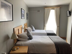 Desk, blackout curtains, iron/ironing board, cots/infant beds